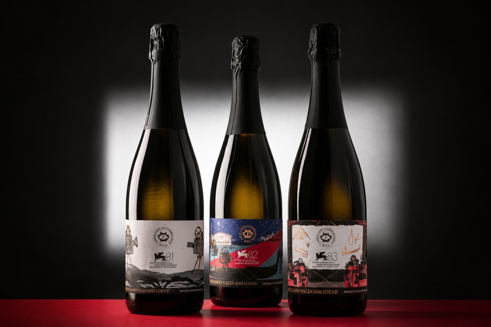 Le tre bottiglie di Prosecco con le etichette pensate per la Mostra del Cinema